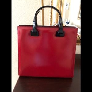 Red patent handbag